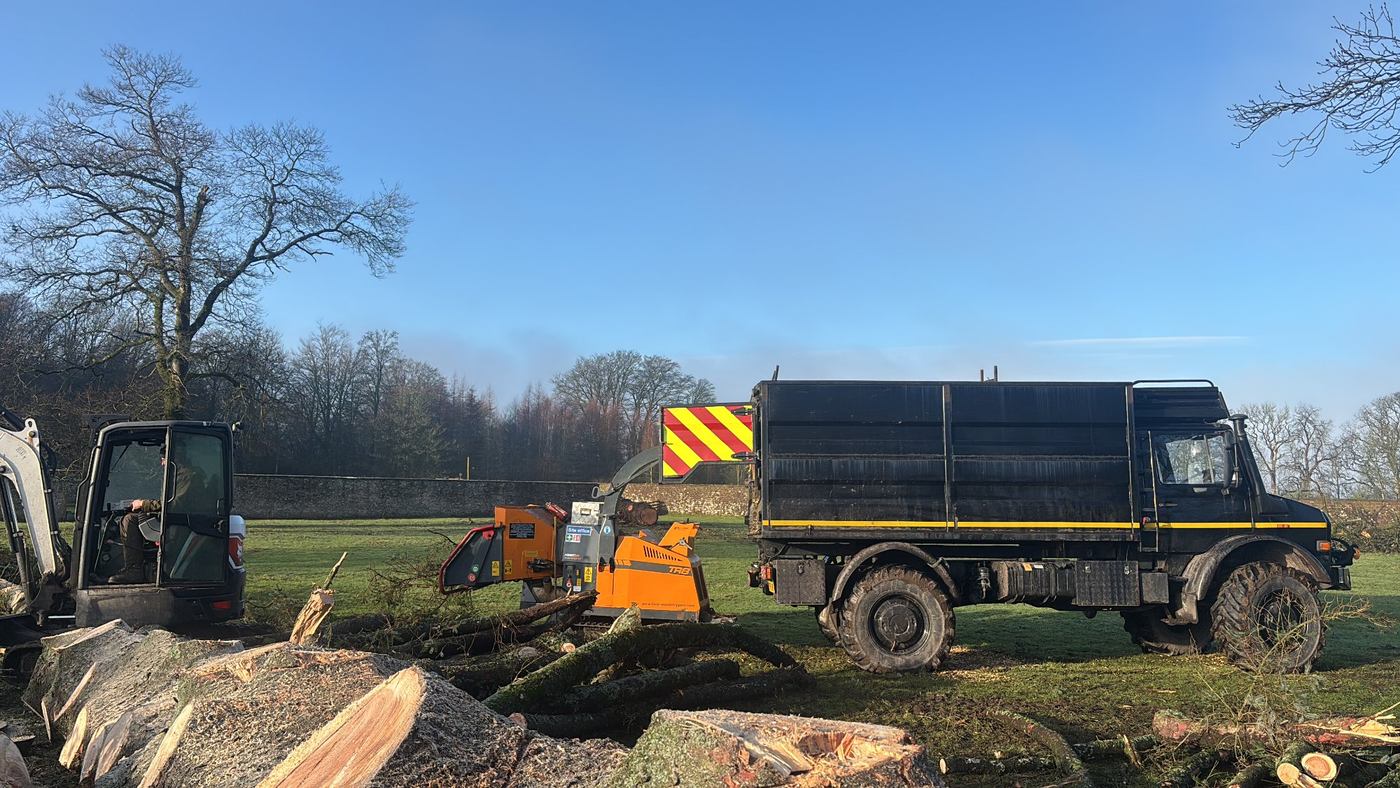 Unimog with front-mounted chipper on a Greater London site clearance job
