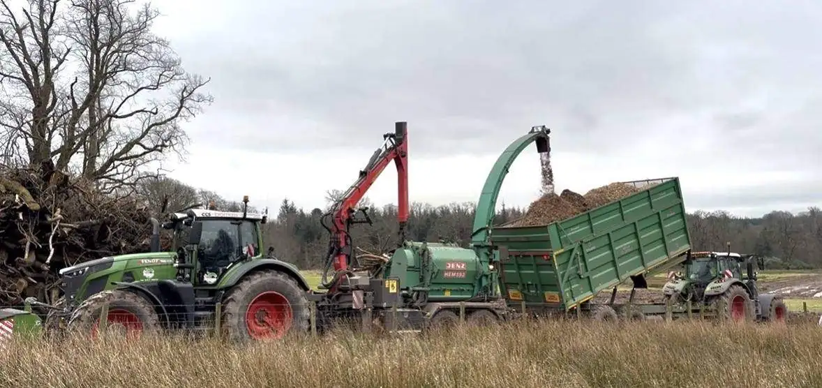 Recovered storm timber being processed and chipped on site