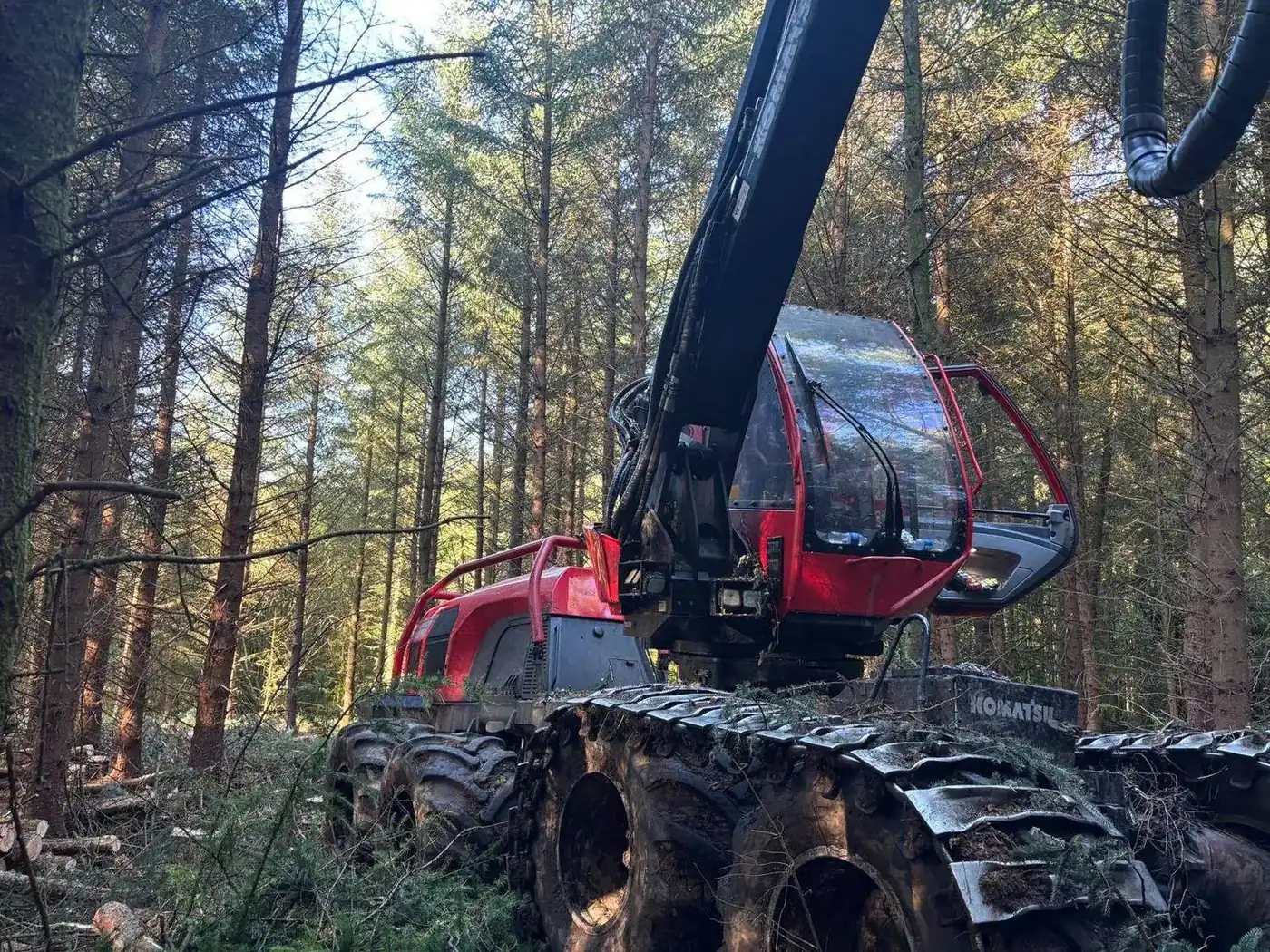 Komatsu harvester in plantation